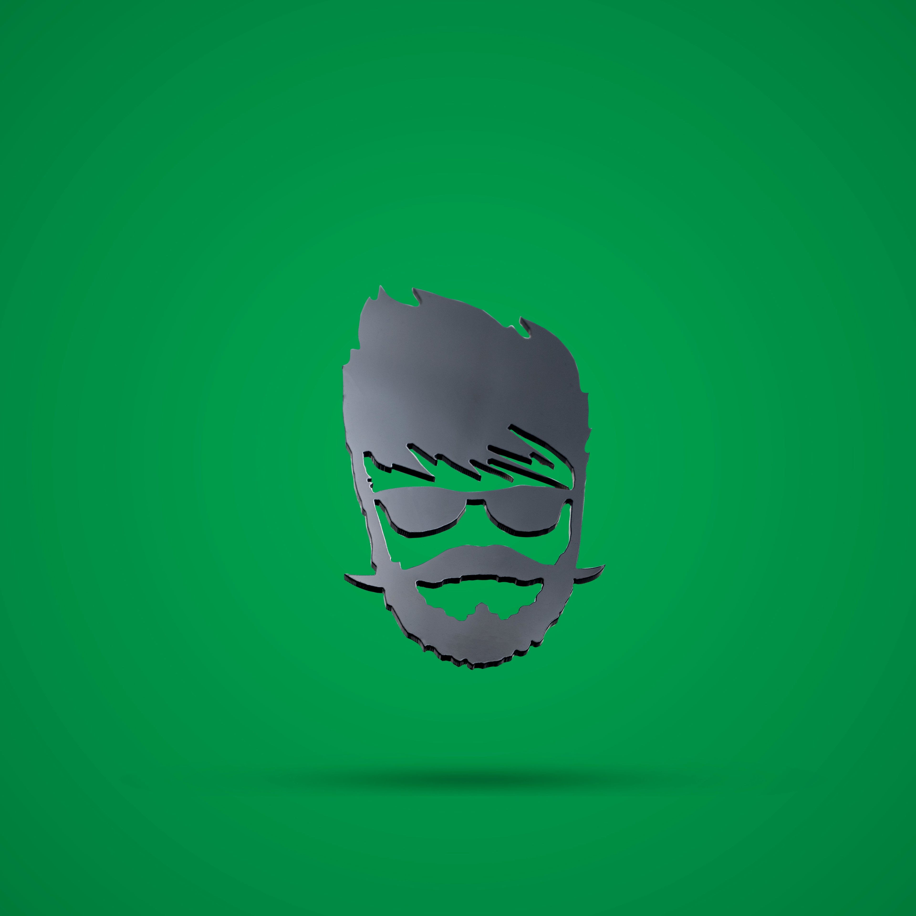 Metallic head silhouette with sunglasses and beard on a green background