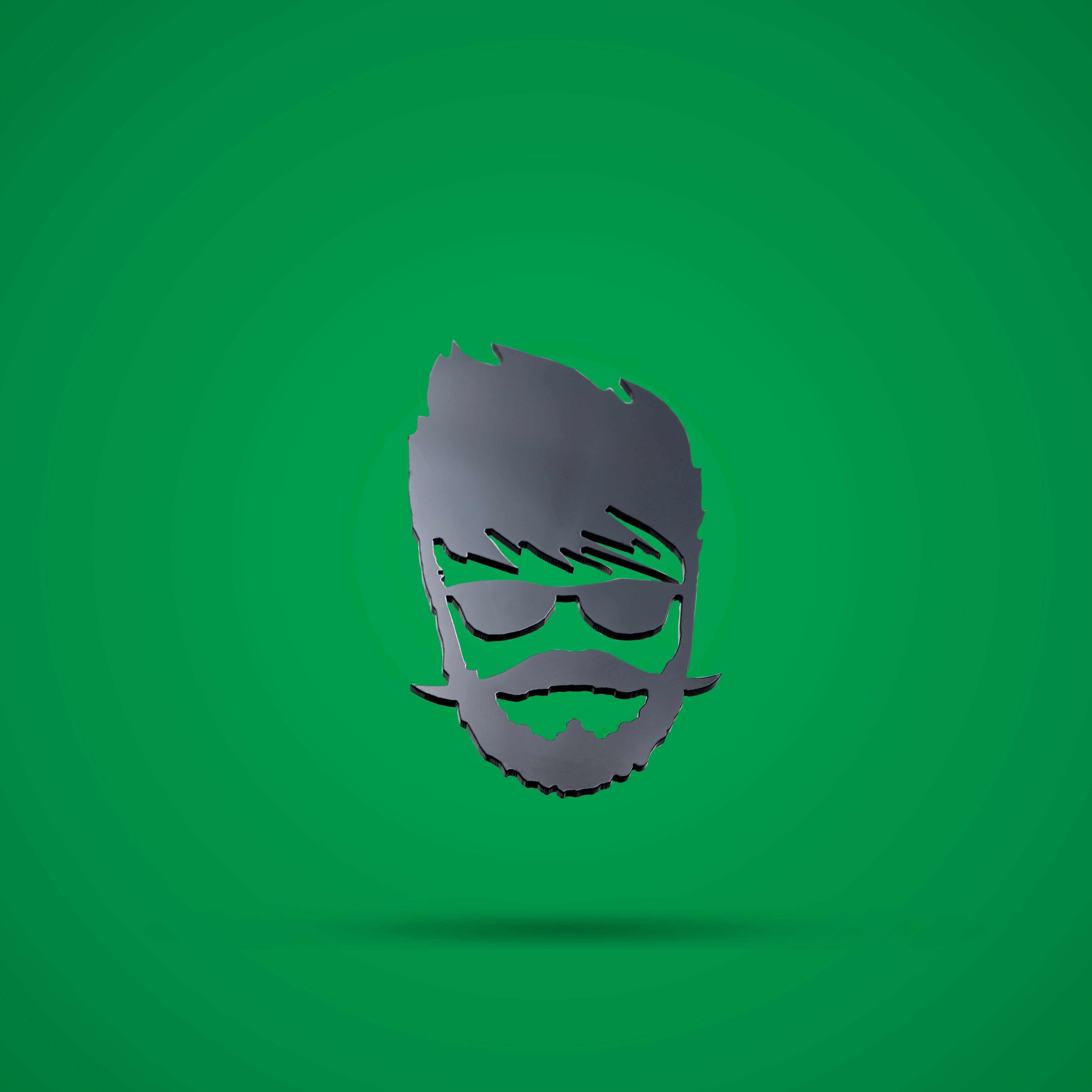 Metallic head silhouette with sunglasses and beard on a green background
