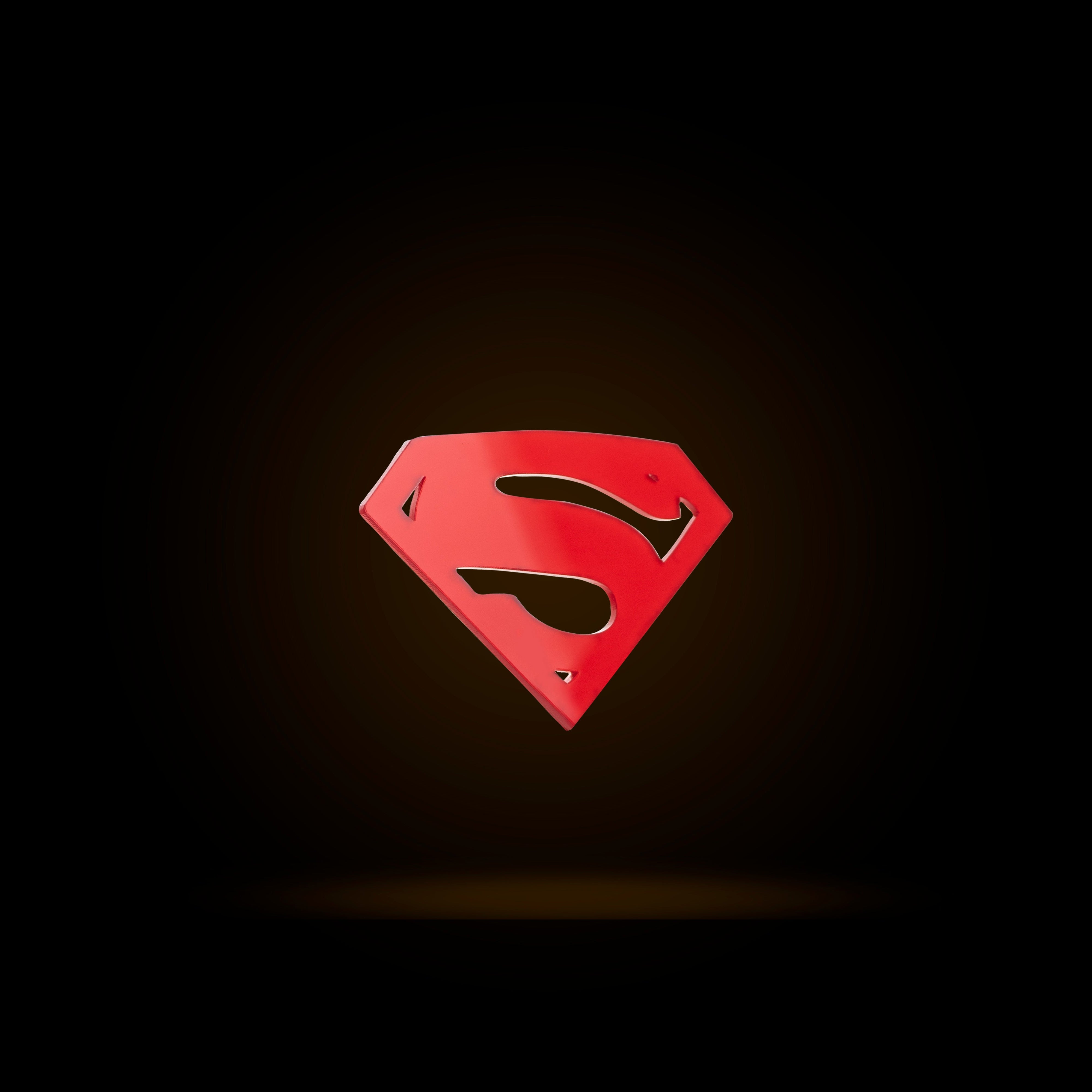 Red Superman logo on a black background