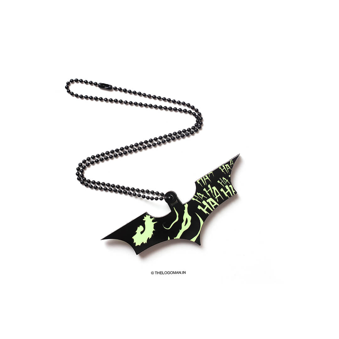 Bat-shaped pendant with chain on a white background