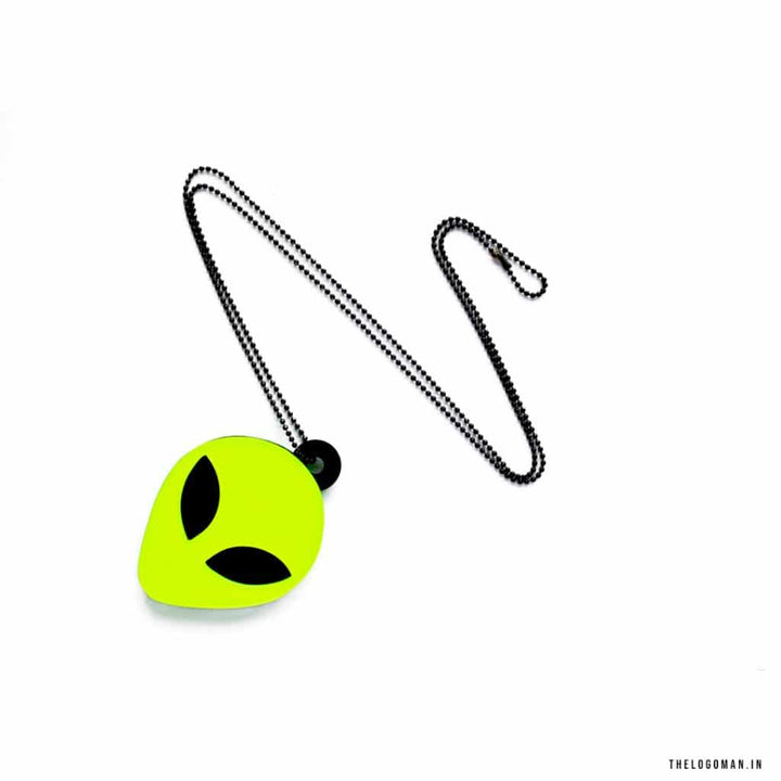 Neon green alien head charm with a black chain on a white background